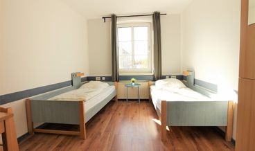 afbeelding van Quadruple Room, Shared Bathroom-2 Twin Beds and 1 Twin Bunk Bed Free WiFi
