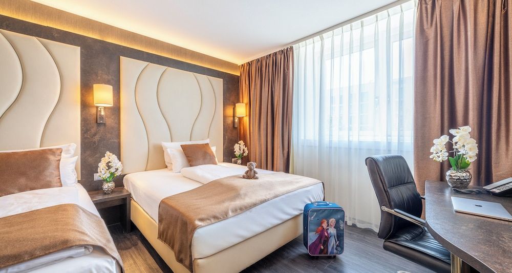 afbeelding van Dreibettzimmer