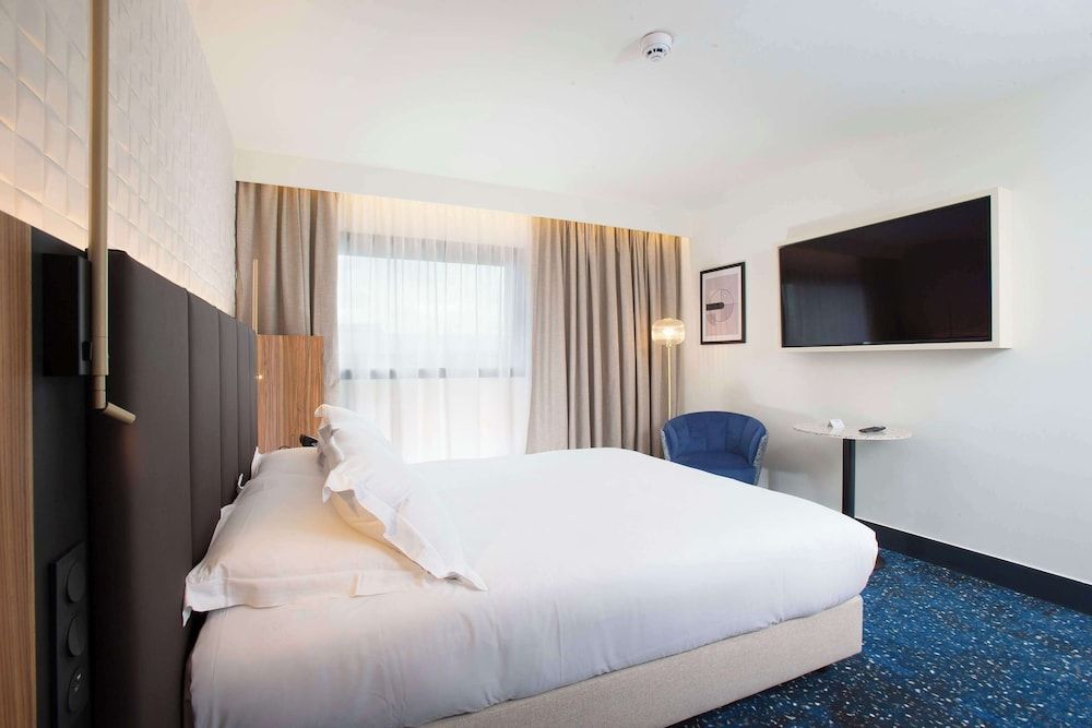 afbeelding van Kamer, 1 kingsize bed, uitzicht op stad